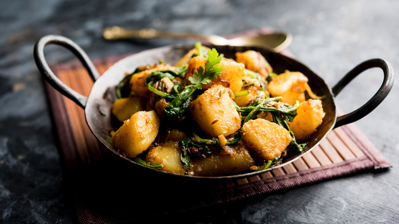 Aloo: The Key to Potatoes in Indian Cuisine Crossword Clue